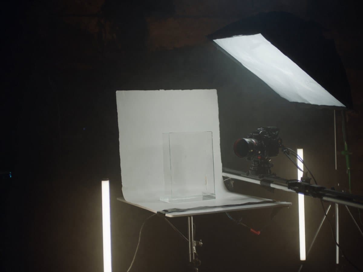 Product tabletop: a white sweep table under a softbox with a camera on a slider